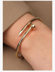 Iconic Gold Nail Wrap Bangle – Chic Modern Jewelry